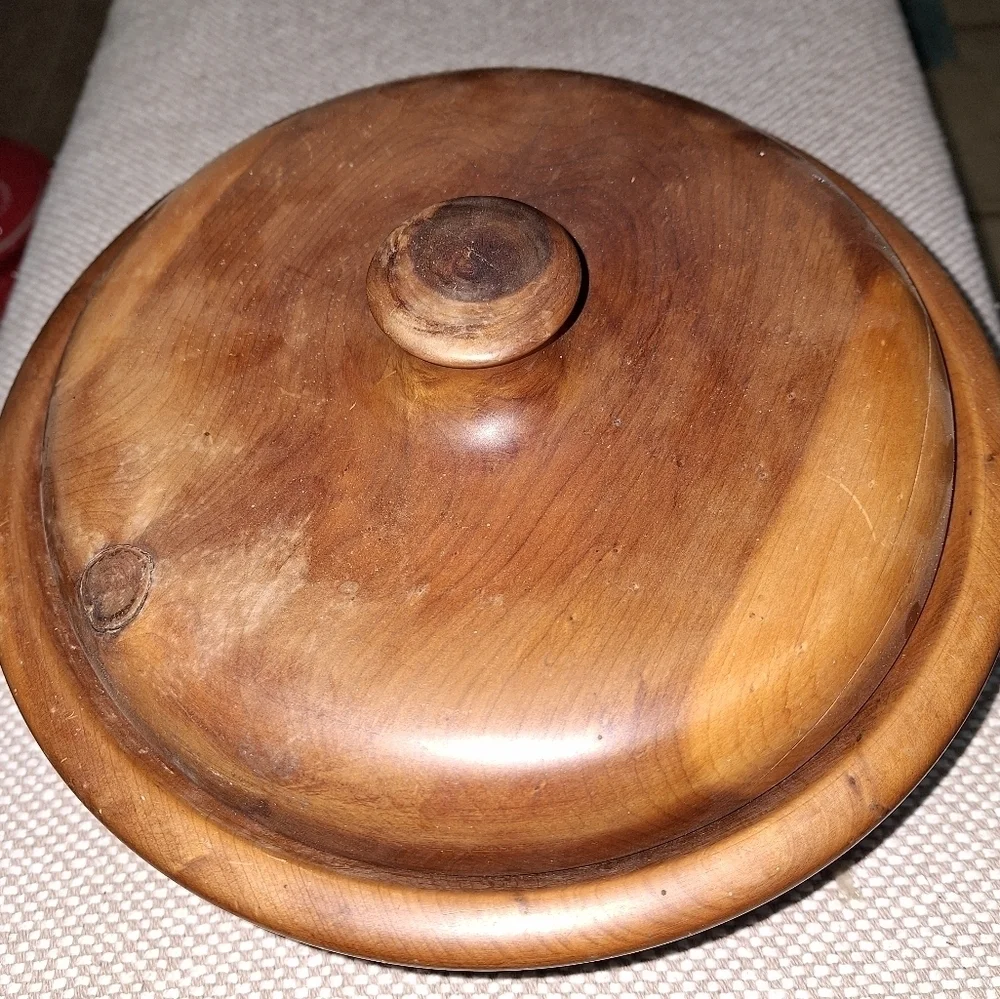 A handmade wooden bowl. It is signed, but I'm not certain of the name.